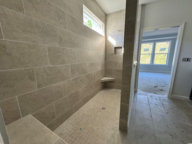 bathroom with a tile shower