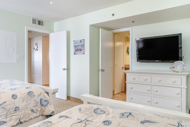 bedroom featuring a textured ceiling