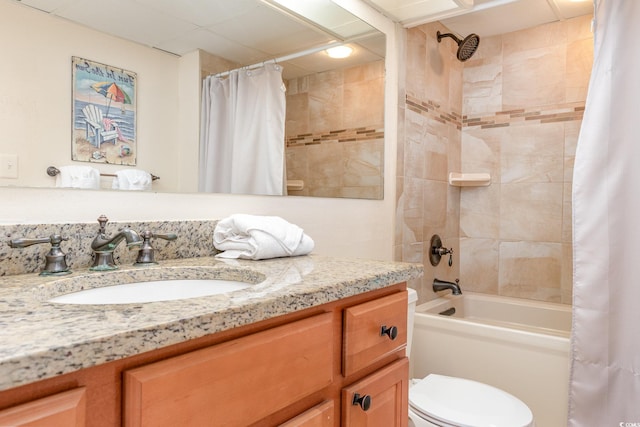 full bathroom featuring shower / tub combo with curtain, vanity, and toilet