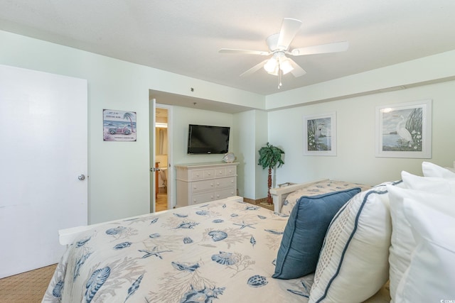 bedroom featuring ensuite bath, ceiling fan, and light colored carpet