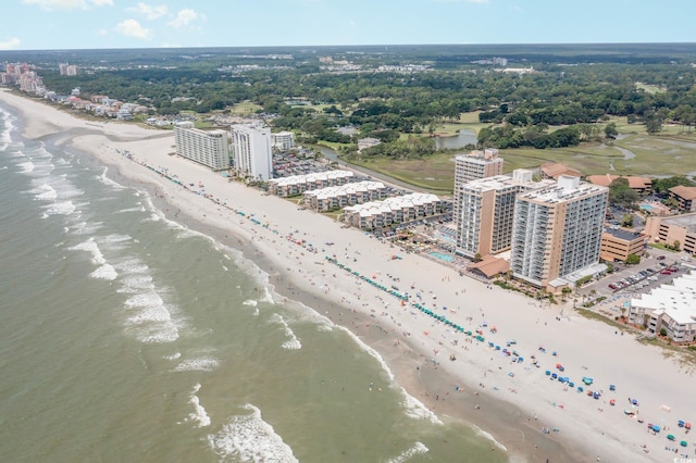 bird's eye view with a water view and a view of the beach