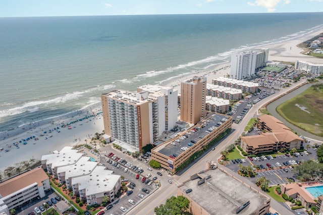 aerial view featuring a water view and a view of the beach