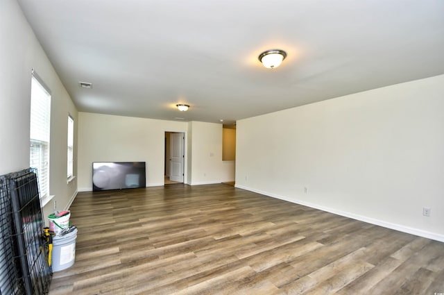 bedroom with a spacious closet, light colored carpet, and a closet