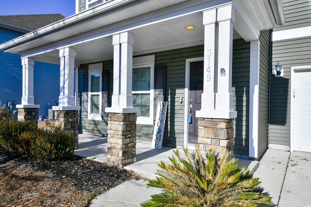 doorway to property featuring a porch