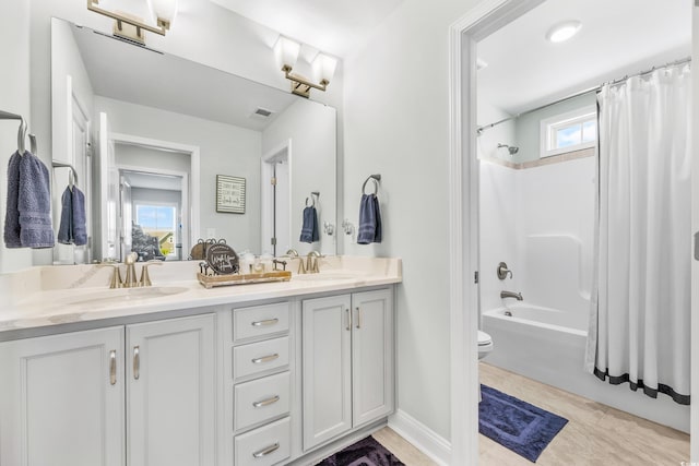 full bathroom featuring vanity, toilet, and shower / bathtub combination with curtain