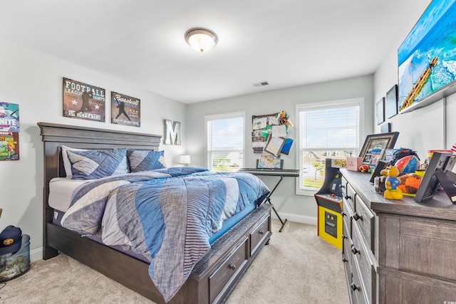 bedroom with light colored carpet