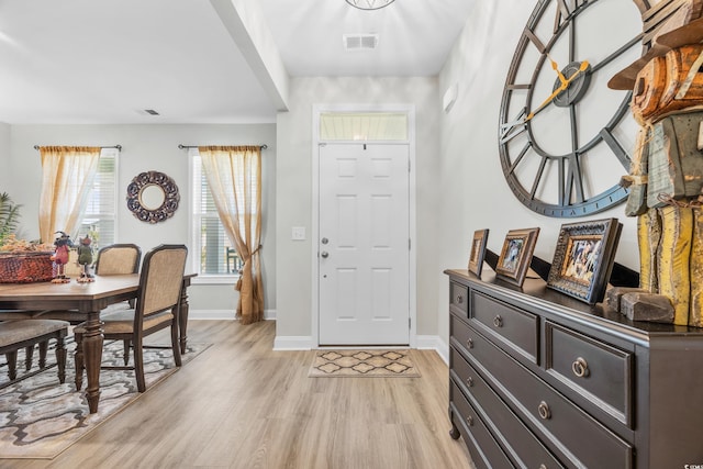 foyer entrance with light wood-type flooring