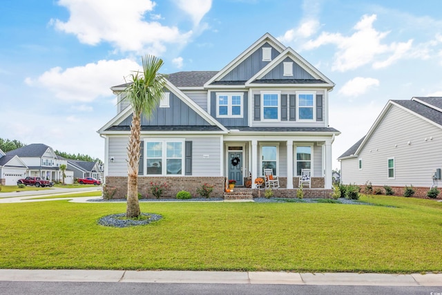 craftsman-style home featuring a front yard and a porch