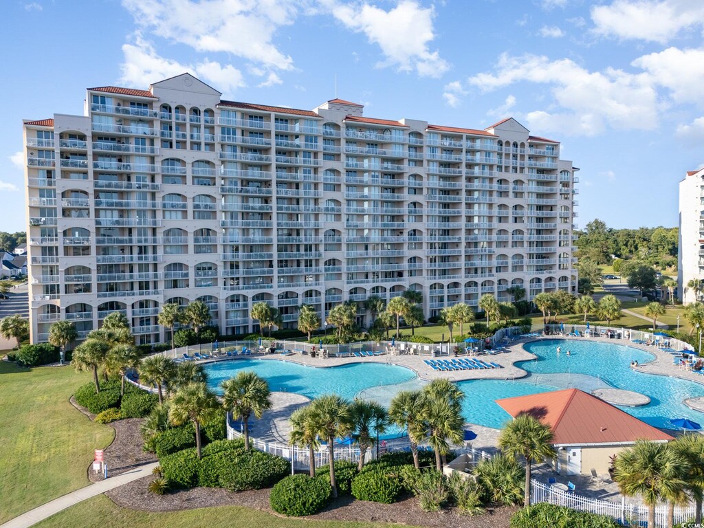 4801 Harbor Pointe Dr Unit 305, North Myrtle Beach, SC 29582 - view of swimming pool featuring a lawn