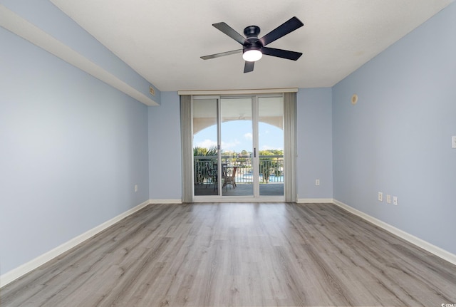 empty room with light hardwood / wood-style floors and ceiling fan