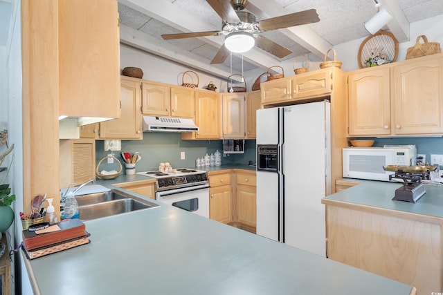 kitchen featuring light brown cabinetry, sink, white appliances, and beam ceiling