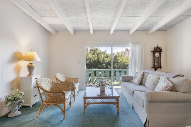 carpeted living room featuring beamed ceiling and wooden walls