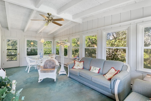 sunroom featuring ceiling fan, plenty of natural light, and lofted ceiling with beams