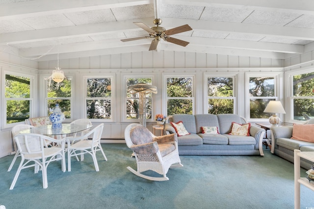 sunroom / solarium with lofted ceiling with beams, a healthy amount of sunlight, and ceiling fan