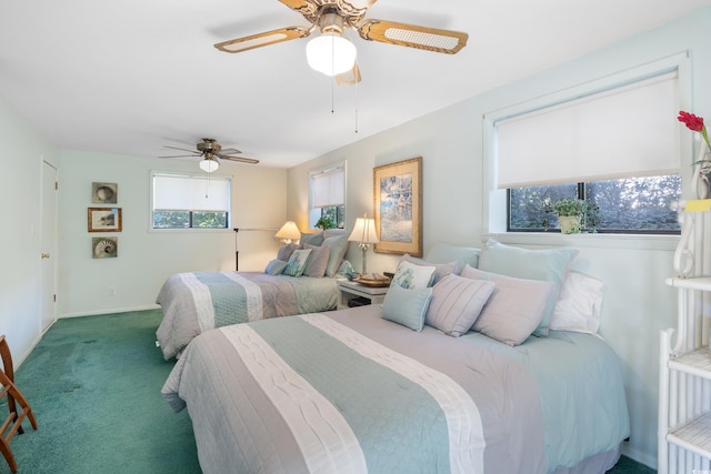 bedroom featuring ceiling fan and dark carpet