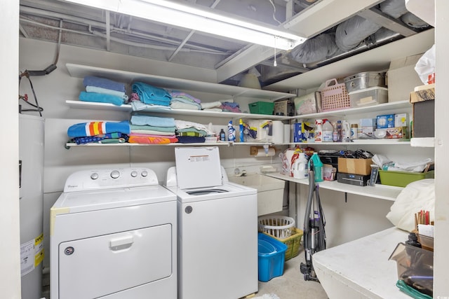 clothes washing area with electric water heater and washing machine and clothes dryer