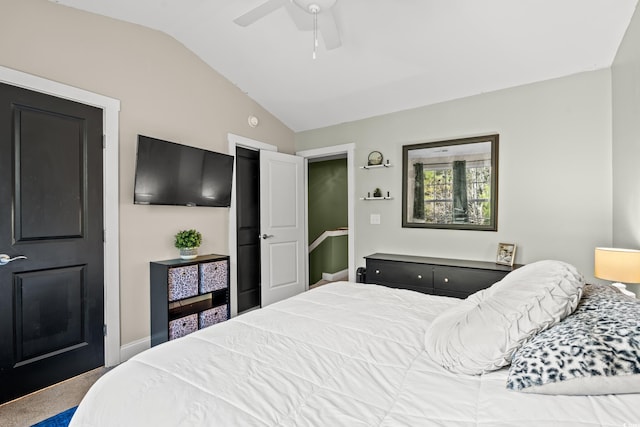 bedroom with ceiling fan, carpet, and vaulted ceiling