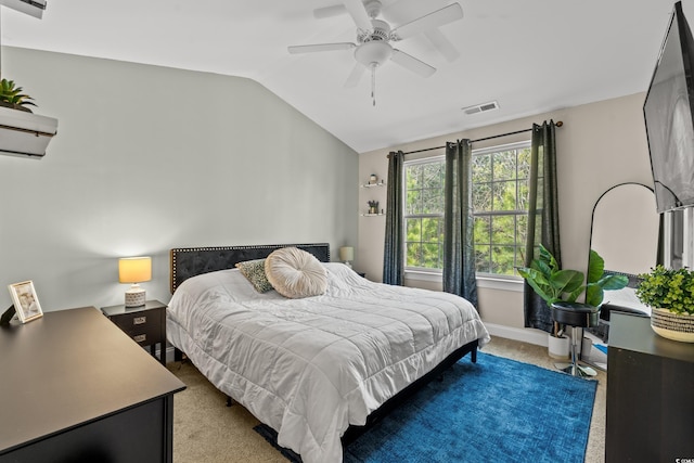 bedroom featuring ceiling fan, vaulted ceiling, a wall mounted air conditioner, and light colored carpet