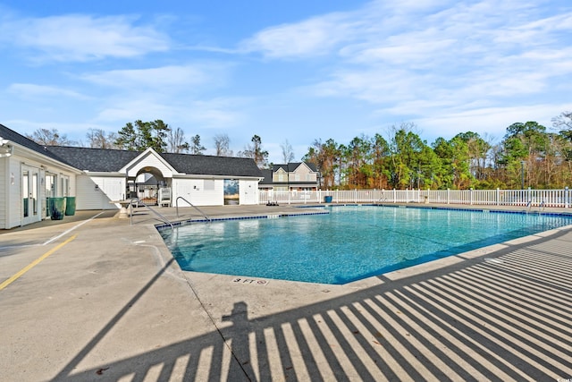 view of swimming pool with a patio