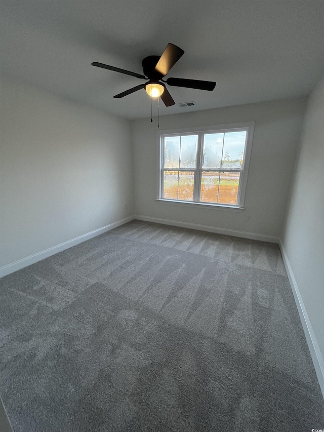 carpeted empty room with ceiling fan