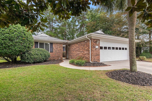 ranch-style home with a front yard and a garage