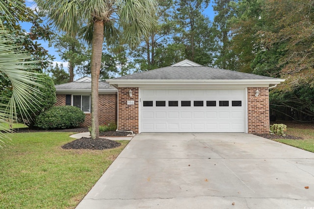 ranch-style home featuring a front yard and a garage