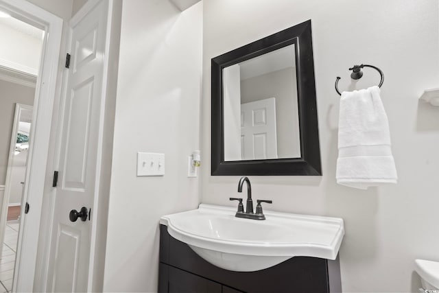 bathroom featuring vanity and toilet