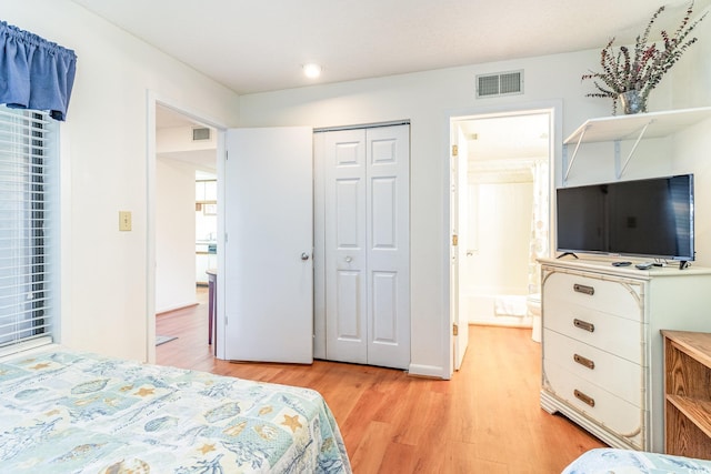 bedroom featuring a closet and light hardwood / wood-style floors