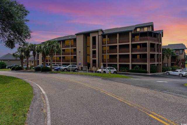 view of outdoor building at dusk