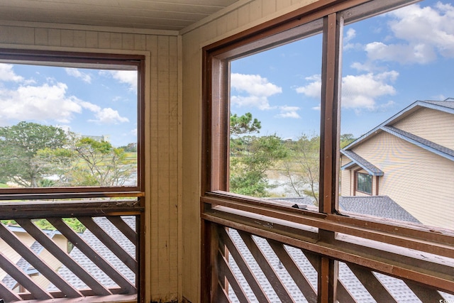 details featuring wood walls and a water view