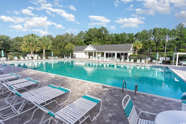 view of swimming pool with a patio