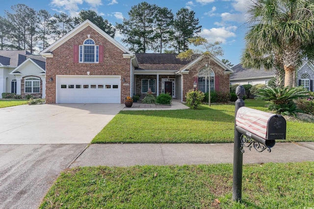 view of property with a garage and a front lawn