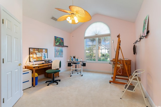 carpeted home office featuring ceiling fan and vaulted ceiling