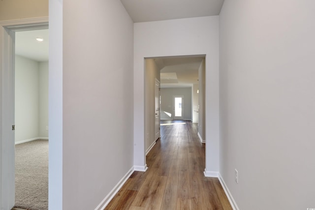 hall with light hardwood / wood-style flooring