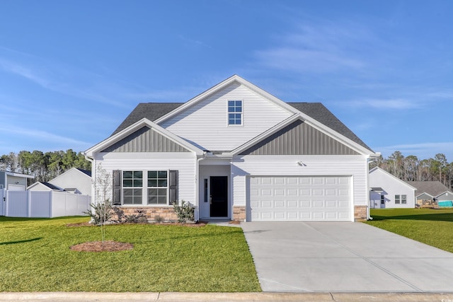 view of front of home with a garage and a front yard