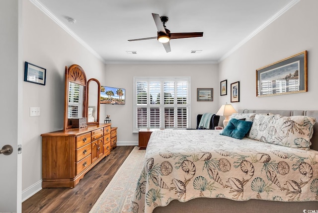 bedroom featuring ornamental molding, ceiling fan, and dark wood-type flooring