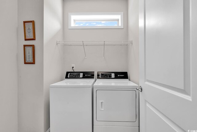 laundry room featuring washer and clothes dryer