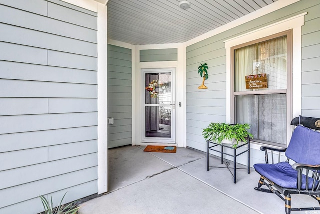 property entrance featuring covered porch