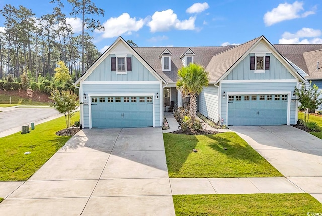 craftsman-style home with a garage and a front lawn