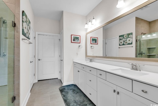 bathroom featuring tile patterned flooring, walk in shower, and vanity