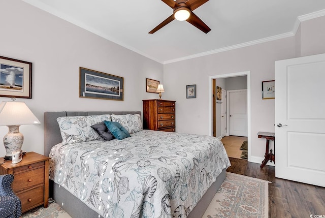 bedroom featuring ceiling fan, crown molding, and dark hardwood / wood-style flooring