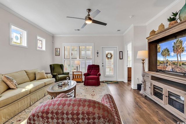 living room featuring ceiling fan, dark hardwood / wood-style floors, and ornamental molding