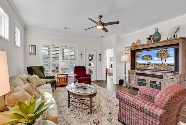 living room featuring ornamental molding, ceiling fan, and hardwood / wood-style floors