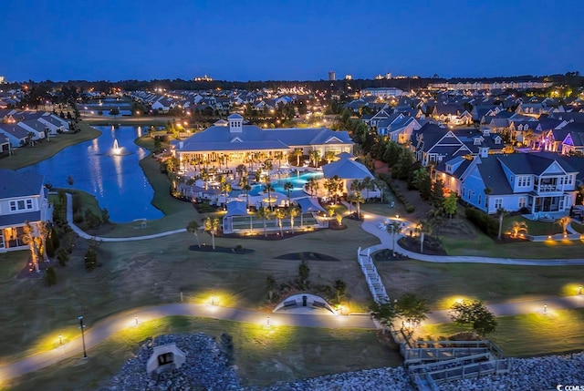 aerial view at twilight with a water view