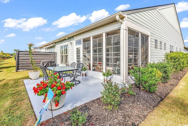 view of patio / terrace with a sunroom