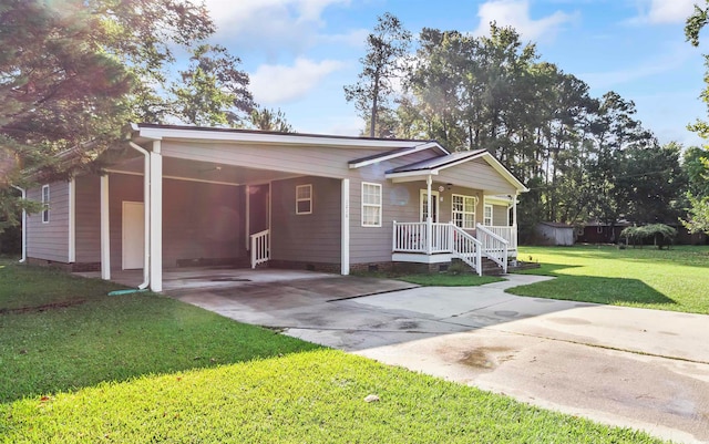 view of front of property featuring a carport, covered porch, and a front yard