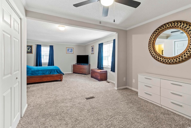 bedroom featuring carpet, multiple windows, and ceiling fan