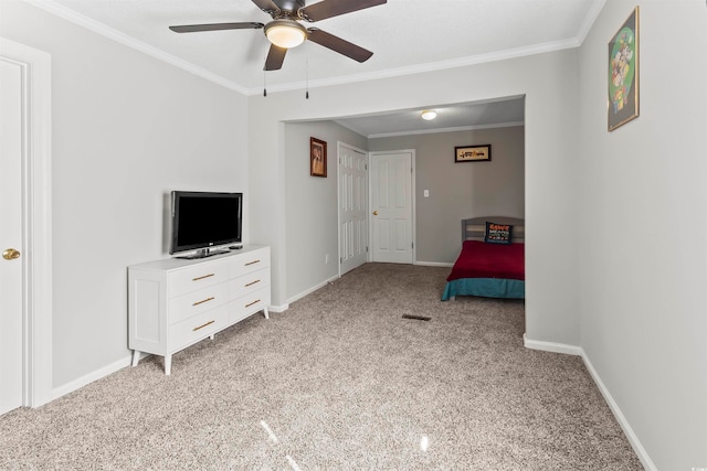 unfurnished bedroom featuring crown molding, ceiling fan, and light colored carpet