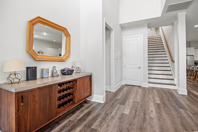 foyer featuring dark wood-type flooring