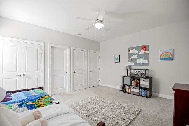 bedroom featuring light carpet and ceiling fan